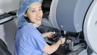 Physician examining tissue sample of fibroid